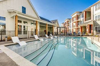 the preserve at ballantyne commons pool and apartment buildings